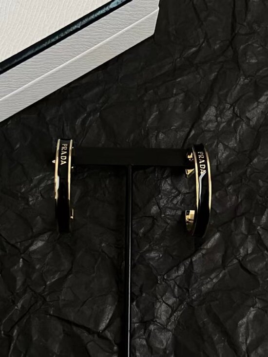 Buy Prada Black Triangle Logo Enamel Stud Earrings in  💐Prada triangular stud earrings